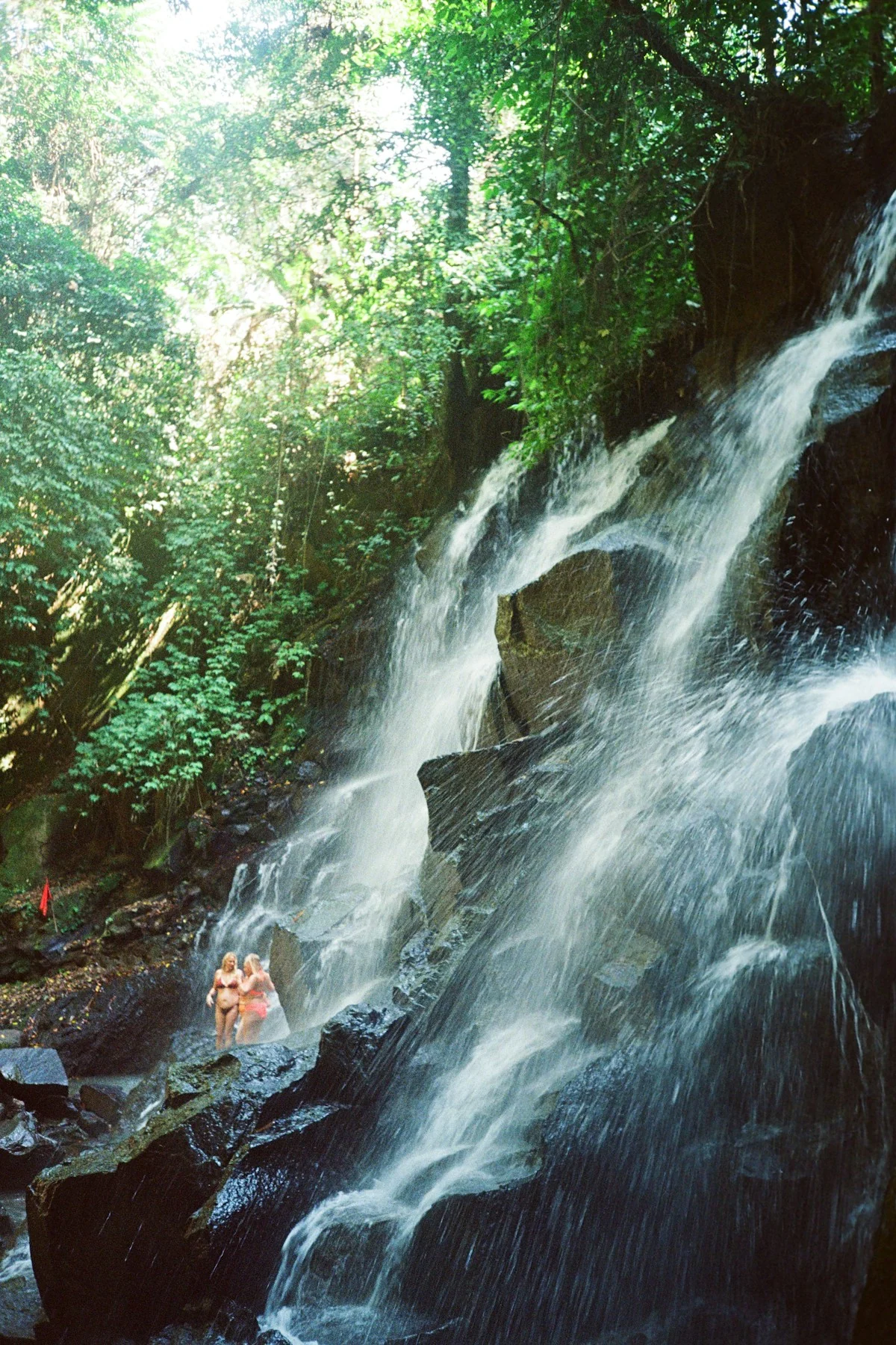 Kanto Lampo Waterfall surrounded by tropical greenery near Ubud